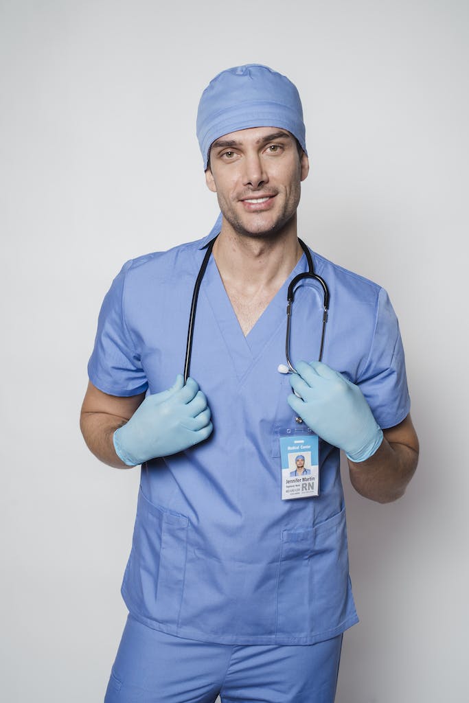 Positive male nurse from Health Staff Group, a leading staffing agency, ready to work.